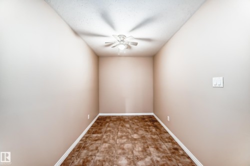 Room with neutral wall paint and tile flooring - 9825 156 Street, Edmonton, AB - Indoor Photo Showing Other Room