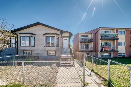 Split-level residence featuring light-colored siding and dark trim - 9825 156 Street, Edmonton, AB - Outdoor With Facade