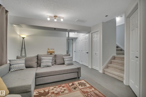 18 Southwick Point(E), Leduc, AB - Indoor Photo Showing Living Room
