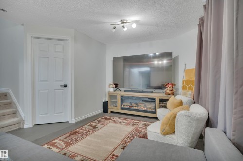 18 Southwick Point(E), Leduc, AB - Indoor With Fireplace