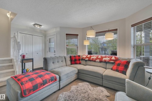 18 Southwick Point(E), Leduc, AB - Indoor Photo Showing Living Room