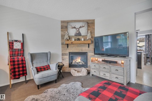 18 Southwick Point(E), Leduc, AB - Indoor With Fireplace
