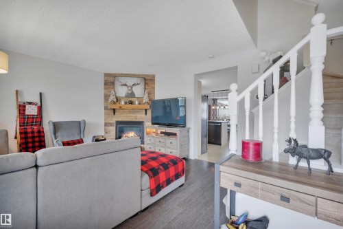 18 Southwick Point(E), Leduc, AB - Indoor Photo Showing Other Room With Fireplace