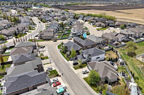 Residential neighborhood with diverse home styles, paved streets, and mature landscaping - 11024 179 Avenue, Edmonton, AB - Outdoor With View