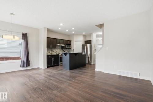 Open-concept living area featuring wood-finish flooring and recessed lighting - 2917 16A Avenue, Edmonton, AB - Indoor Photo Showing Kitchen