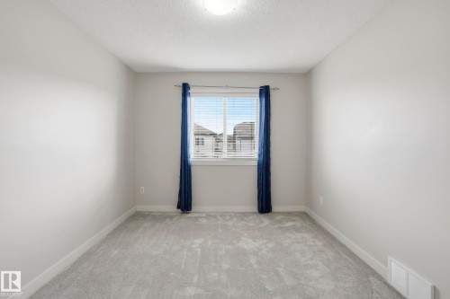 Carpeted room with a central window - 2917 16A Avenue, Edmonton, AB - Indoor Photo Showing Other Room