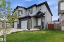 Contemporary two-story exterior with light gray siding and dark trim accents - 2917 16A Avenue, Edmonton, AB  - Outdoor 