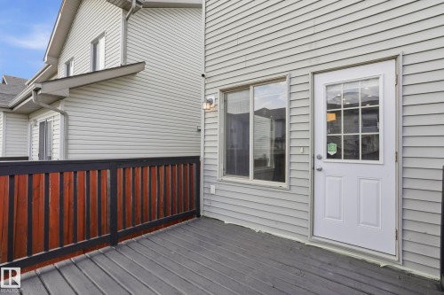 Expansive outdoor deck featuring composite decking, a two-tone privacy fence, and direct exterior access - 2917 16A Avenue, Edmonton, AB - Outdoor With Exterior