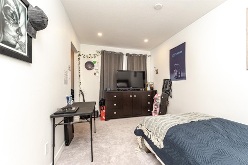 Carpeted room featuring recessed lighting and neutral wall tones - 17716 84 Ave, Edmonton, AB - Indoor Photo Showing Bedroom