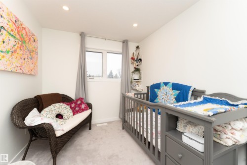 Carpeted interior room with white walls, recessed ceiling lighting, and a window with curtains - 17716 84 Ave, Edmonton, AB - Indoor