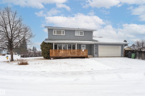 Contemporary split-level home featuring a light gray exterior - 17716 84 Ave, Edmonton, AB - Outdoor With Deck Patio Veranda With Facade