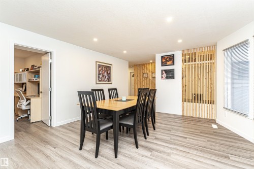 Open-concept dining area featuring wood-finish flooring and recessed lighting - 17716 84 Ave, Edmonton, AB - Indoor Photo Showing Dining Room