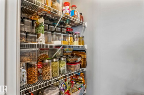 Built-in pantry with multiple wire shelving tiers - 5142 23A Avenue, Edmonton, AB - Indoor Photo Showing Other Room