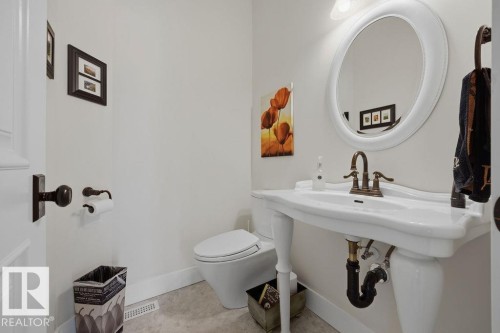Two piece main floor powder room. - 11137 81 Avenue, Edmonton, AB - Indoor Photo Showing Bathroom