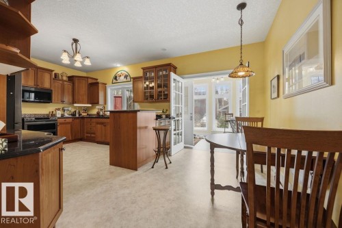 Full eat-in kitchen, with French doors to the four season sunroom. - 11137 81 Avenue, Edmonton, AB - Indoor Photo Showing Kitchen