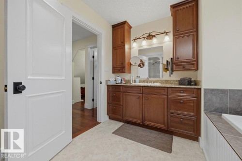 The four piece en-suite features a large vanity with excellent storage, soaker tub, and sit/stand shower. - 11137 81 Avenue, Edmonton, AB - Indoor Photo Showing Bathroom