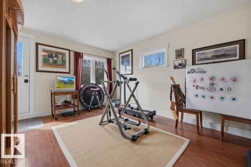 Third bedroom, with access to the south facing balcony that overlooks the back yard. - 11137 81 Avenue, Edmonton, AB - Indoor Photo Showing Gym Room