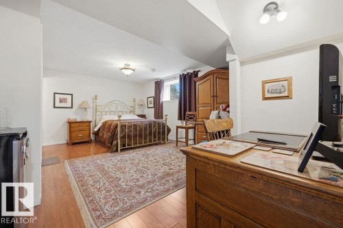 The stand-alone basement bedroom, which has it's own four piece en-suite, and workspace nook. - 11137 81 Avenue, Edmonton, AB - Indoor Photo Showing Other Room