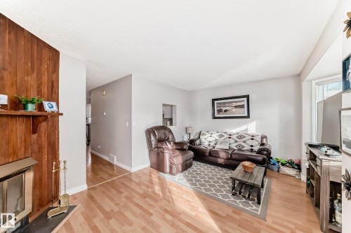 18 10453 20 Avenue, Edmonton, AB - Indoor Photo Showing Living Room With Fireplace