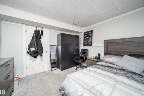 Carpeted room featuring light gray walls and white trim - 14808 96 Street, Edmonton, AB - Indoor Photo Showing Bedroom
