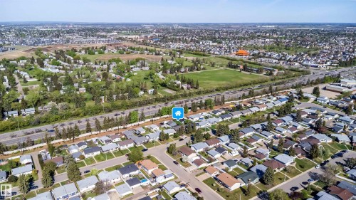 Aerial perspective showcasing a residential neighborhood with established homes and mature landscaping - 14808 96 Street, Edmonton, AB - Outdoor With View