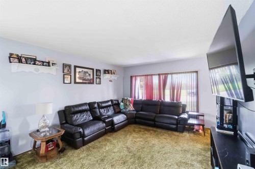 5437 49 Avenue, Andrew, AB - Indoor Photo Showing Living Room With Fireplace