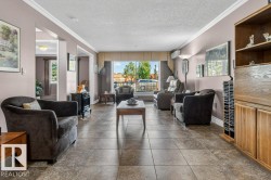 Living room with patio doors to fenced area facing north - 