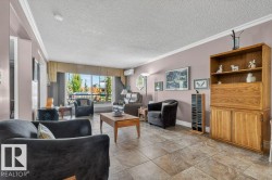 Note the beautiful calm wall color and newer vinyl tile throughout. - 