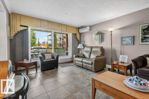 Note the beautiful blinds and valance.  The decorating has been carefully thought out to pull the colors together. - 101 10903 21 Avenue Nw, Edmonton, AB - Indoor Photo Showing Living Room