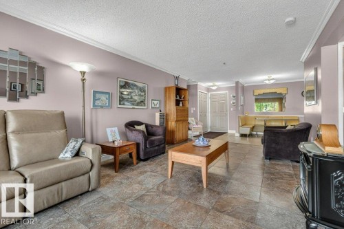 Can you spot the beautiful, unique electric fireplace? - 101 10903 21 Avenue Nw, Edmonton, AB - Indoor Photo Showing Living Room