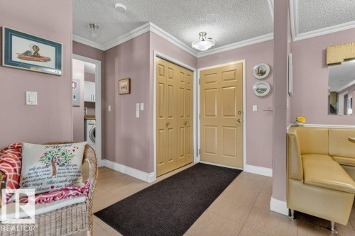 This entry is very roomy and has a closet for your coats and shoes. - 101 10903 21 Avenue Nw, Edmonton, AB - Indoor Photo Showing Other Room