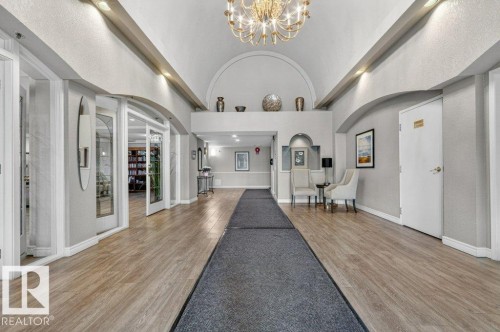 Beautiful entry to condo with soaring ceilings.  Office, mail room just to  your right. - 101 10903 21 Avenue Nw, Edmonton, AB - Indoor Photo Showing Other Room