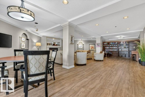 The library is very large with several tables to meet with friends. - 101 10903 21 Avenue Nw, Edmonton, AB - Indoor Photo Showing Dining Room