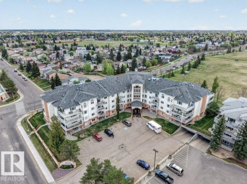Amazing location with park in the back of complex and many stores, restaurants, doctors and dentists right across the street.  Everything in walking distance. - 101 10903 21 Avenue Nw, Edmonton, AB - Outdoor With View