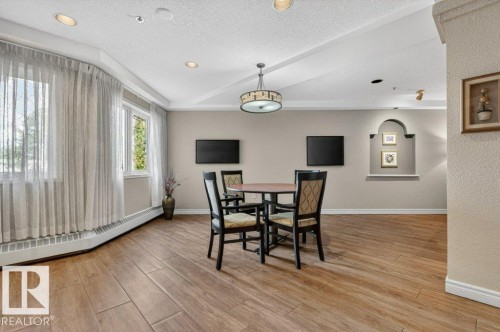 Another place to gather in the library - 101 10903 21 Avenue Nw, Edmonton, AB - Indoor Photo Showing Dining Room