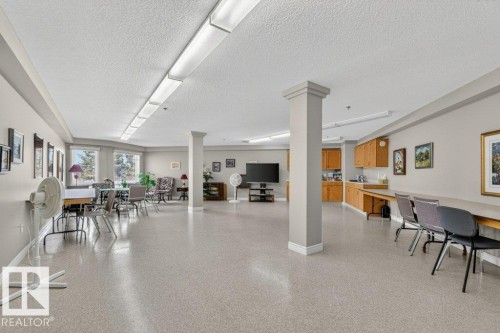 This is a large craft room.  A place to meet, do crafts and share ideas.  The cabinets hold many kinds of artsy things. - 101 10903 21 Avenue Nw, Edmonton, AB - Indoor