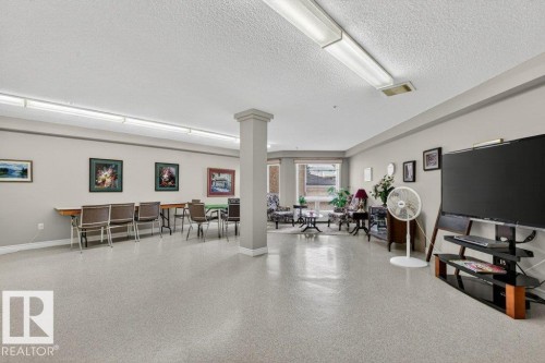 There is so much room to do crafts and enjoy the company of your neighbours while you are working.  Easy clean up with a sink and some cabinetry. - 101 10903 21 Avenue Nw, Edmonton, AB - Indoor