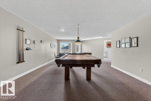 Enjoy a game of pool,darts or shuffleboard in our games room. - 101 10903 21 Avenue Nw, Edmonton, AB - Indoor Photo Showing Other Room