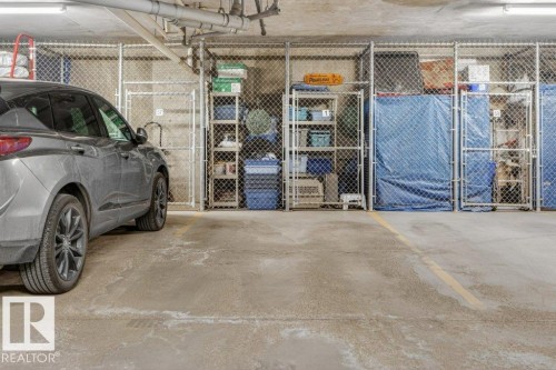 The parking spot and storage cage is #1 and is not too far from the elevator. - 101 10903 21 Avenue Nw, Edmonton, AB - Indoor Photo Showing Garage