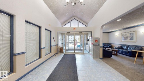 Vaulted ceiling entry foyer with tiled flooring and a carpeted runner - 405 16303 95 Street Nw, Edmonton, AB -  Photo Showing Other Room