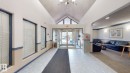 Vaulted ceiling entry foyer with tiled flooring and a carpeted runner - 405 16303 95 Street Nw, Edmonton, AB  -  Photo Showing Other Room 