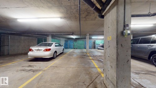 Dedicated parking space with concrete flooring - 405 16303 95 Street Nw, Edmonton, AB - Indoor Photo Showing Garage