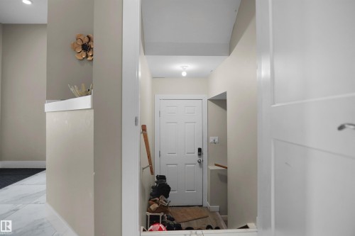 Entryway featuring a white paneled door, light neutral wall colors, and a recessed ceiling light - 6108 173 Ave, Edmonton, AB 