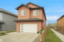 Contemporary two-story stucco exterior with a prominent attached garage - 6108 173 Ave, Edmonton, AB 