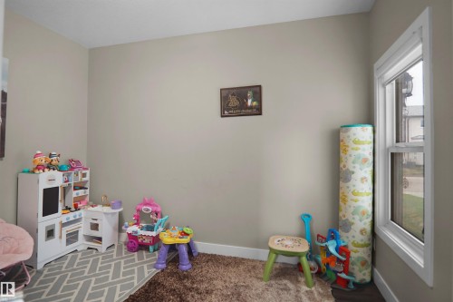 Room featuring light neutral wall paint and white baseboards - 6108 173 Ave, Edmonton, AB 