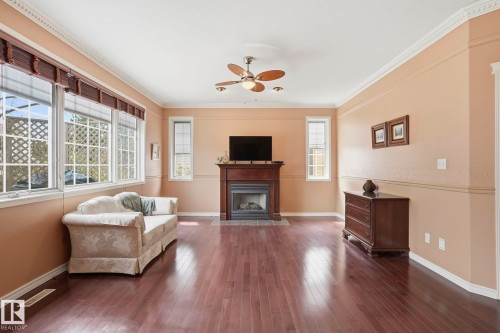 7 J. Brown Place, Leduc, AB - Indoor Photo Showing Living Room With Fireplace