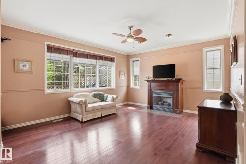 7 J. Brown Place, Leduc, AB - Indoor Photo Showing Living Room With Fireplace