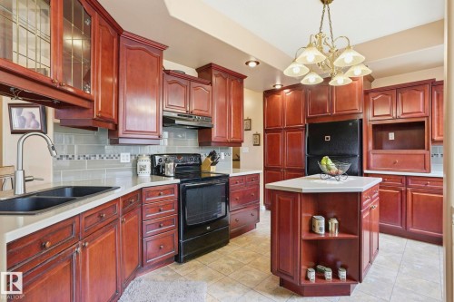 7 J. Brown Place, Leduc, AB - Indoor Photo Showing Kitchen With Double Sink