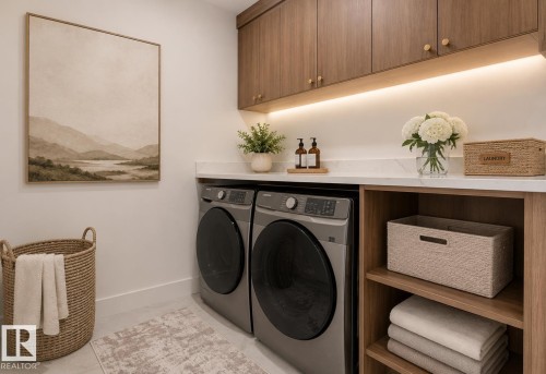 Laundry area featuring wood-finish cabinetry with gold-tone hardware, under-cabinet lighting, and a white countertop - 4727 17 Avenue, Edmonton, AB - Indoor Photo Showing Laundry Room