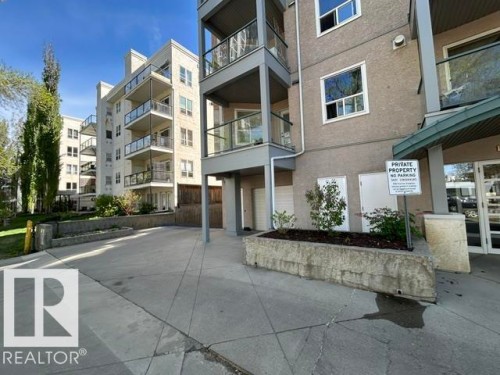 Multi-story building exterior featuring balconies with glass railings and a textured facade - 304 10011 110 Street, Edmonton, AB - Outdoor